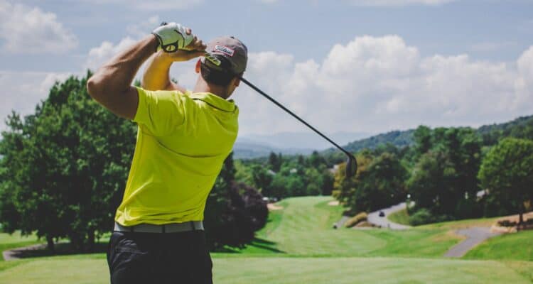 man playing golf during daytime